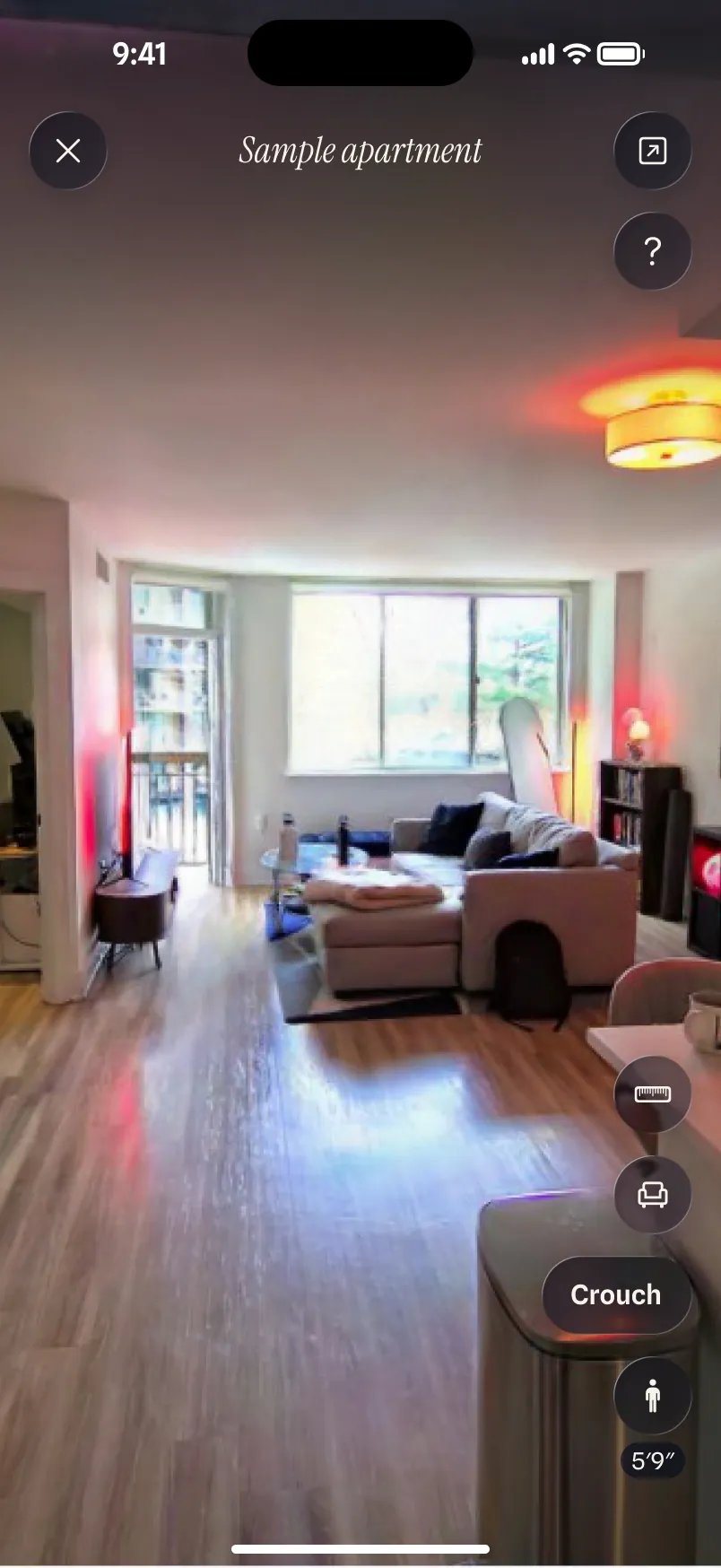 Design of the renter app walking through the sample apartment's living room, with Crouch and eye-height controls.