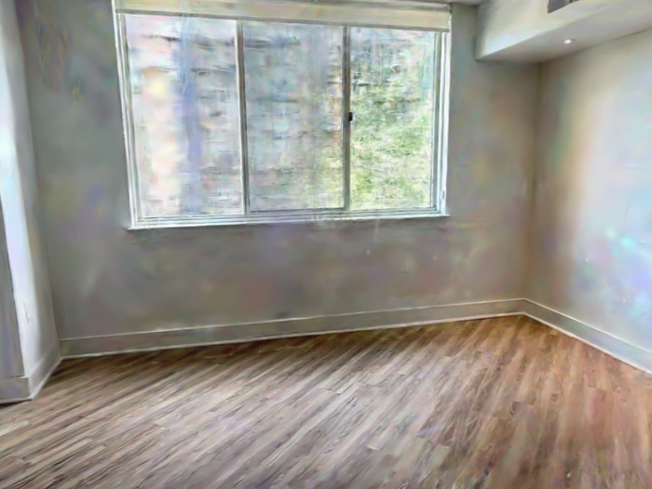 Photorealistic Spatia render of the apartment's main room: bare walls, large window, wood floor